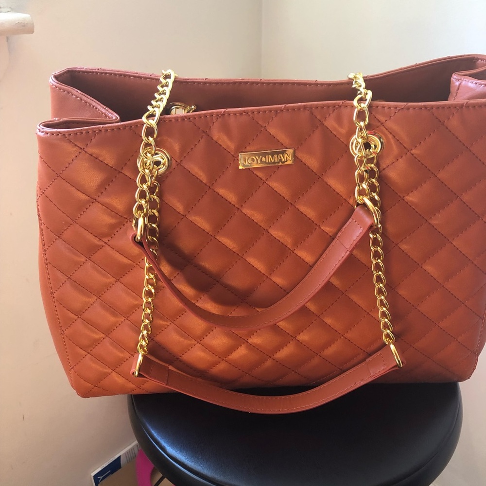 Joy and iman handbag never used new. The side has a few wrinkles